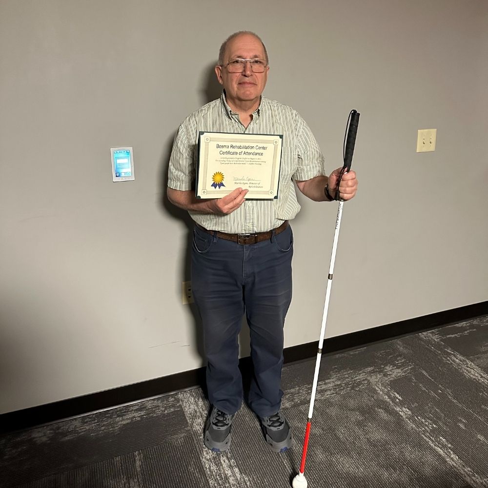 Eugene Soyfer is pictured at graduation holding his 8-week program completion certificate