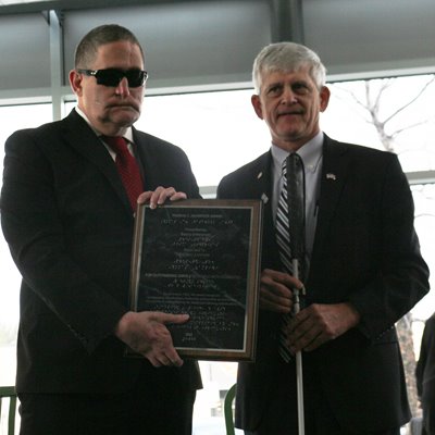 Jeff Mittman presenting the Hasbrook Award to Tom Zampieri